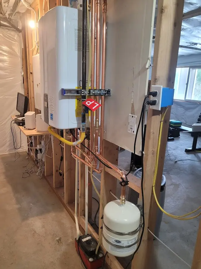 Licensed plumber repairing a kitchen sink in Red Hook